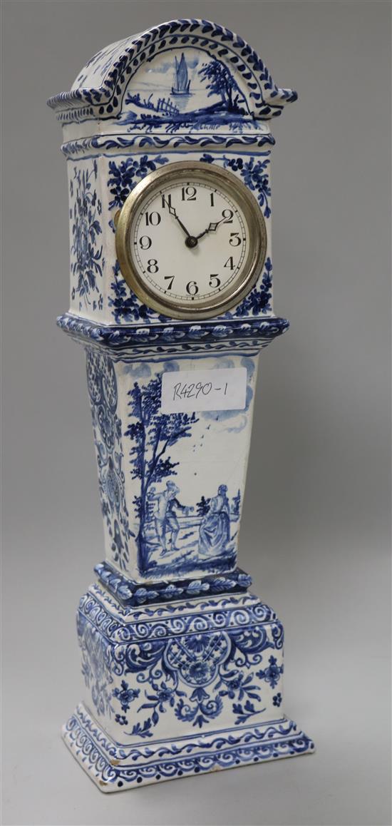 A Continental tinglazed pottery model of a longcase clock